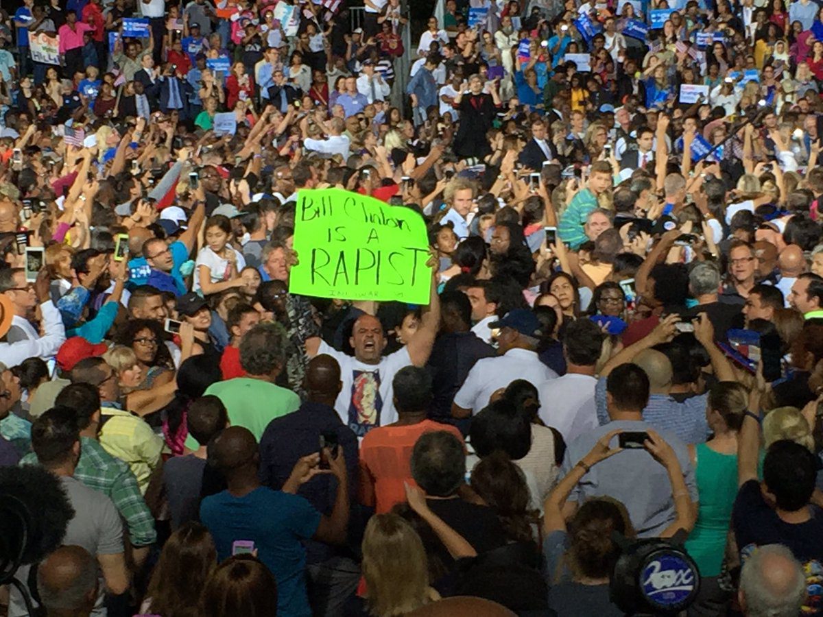 hillary-clinton-bill-clinton-rapist-protester-ft-lauderdale-josh-haskell-twitter