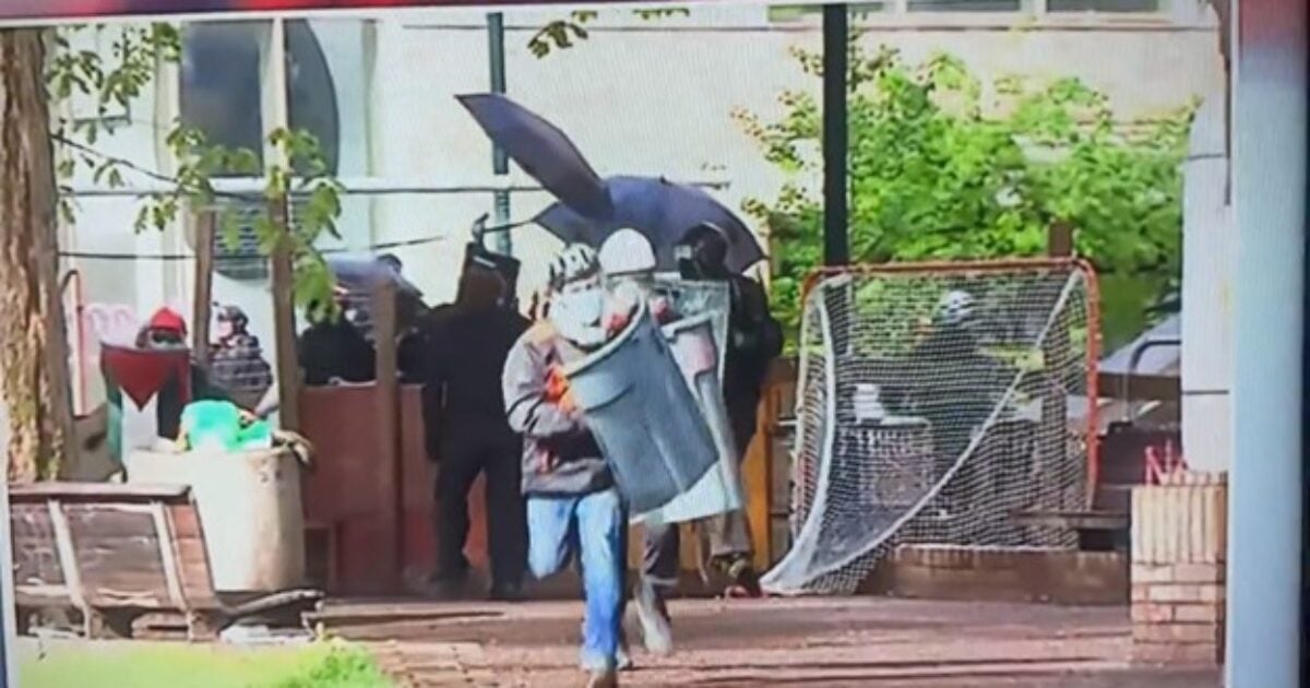 Pro-Hamas Idiot Using Garbage Can as Shield Charges Awkwardly at Police and Gets a Rude Awakening During Protest at Portland State University (VIDEO)