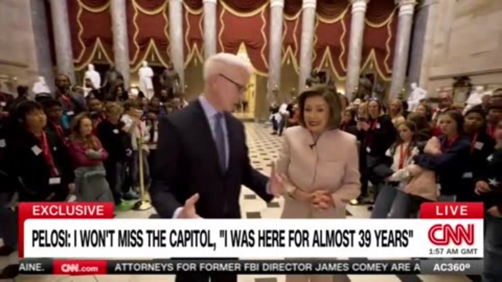 Anderson Cooper interviews Nancy Pelosi in the Capitol, surrounded by a crowd, discussing her long tenure in Congress.