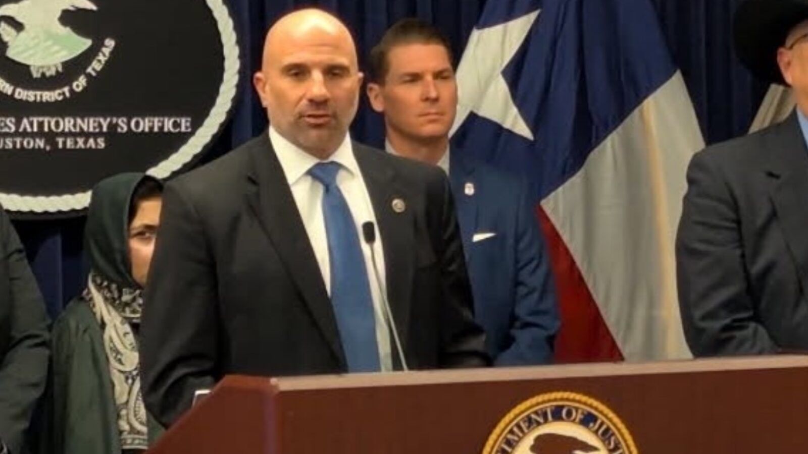 Press conference at the U.S. Attorney's Office in Houston, Texas, featuring officials discussing legal matters and community safety initiatives.