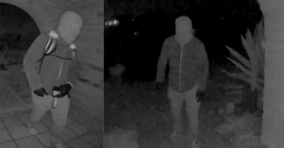 Surveillance footage captures a masked individual walking near a residence at night, highlighting potential security concerns for homeowners.