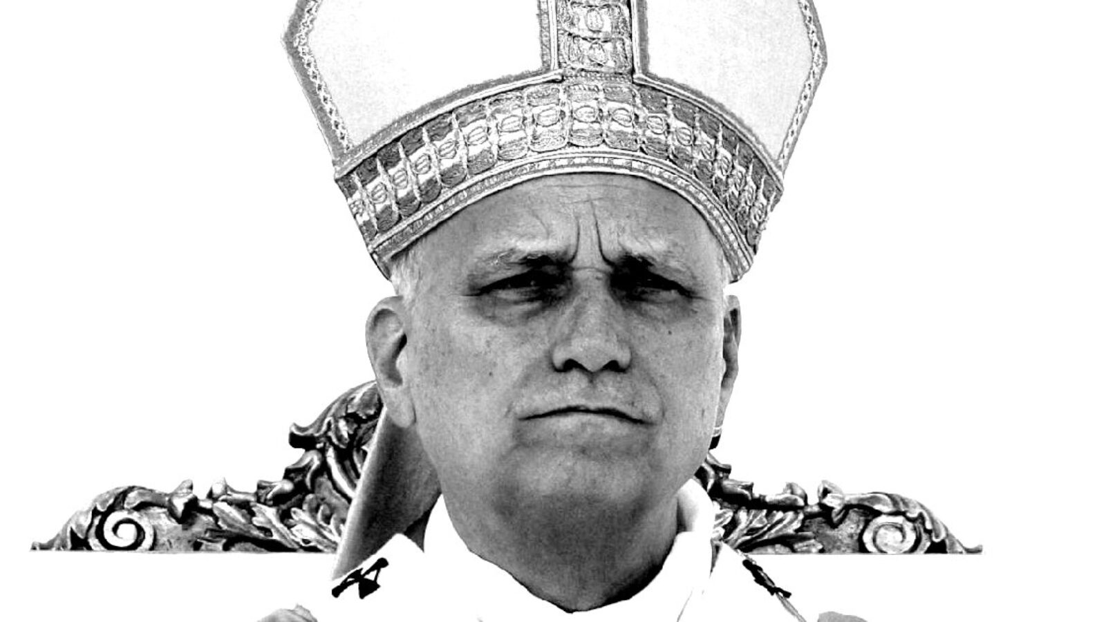 Black and white portrait of a religious leader wearing a ceremonial mitre, conveying a solemn expression in a decorative setting.