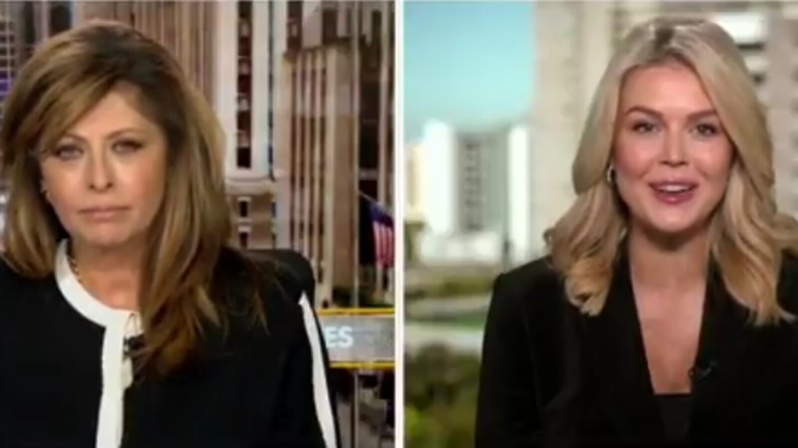 Two female news anchors discussing current events, with a backdrop of city buildings and American flags visible in the background.