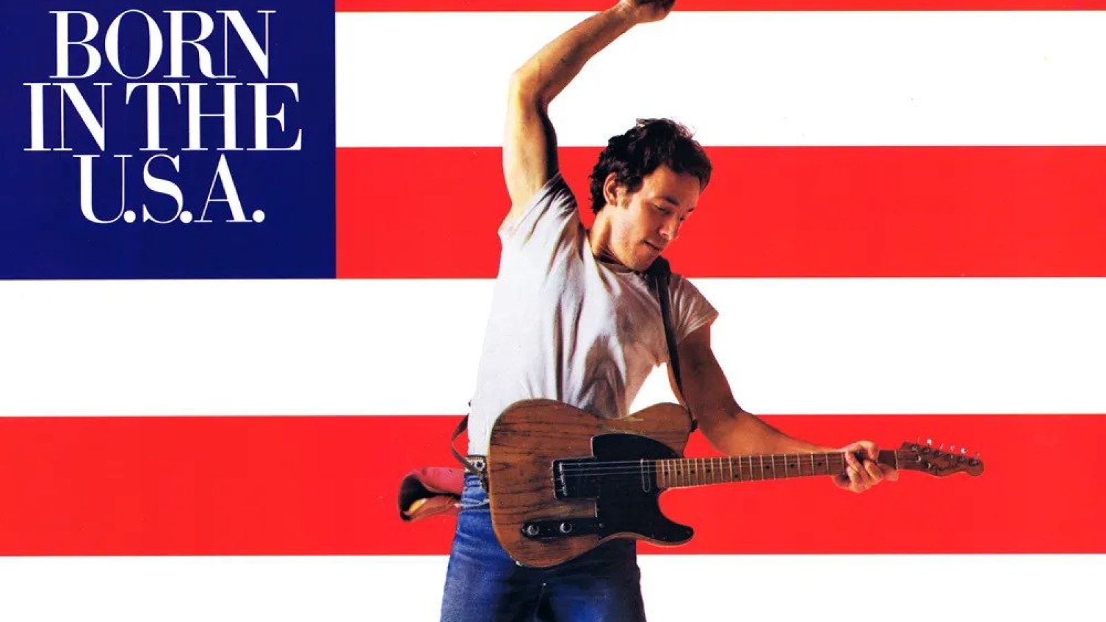 Album cover of Bruce Springsteen's "Born in the U.S.A." featuring the artist jumping with a guitar against a red and white striped background.