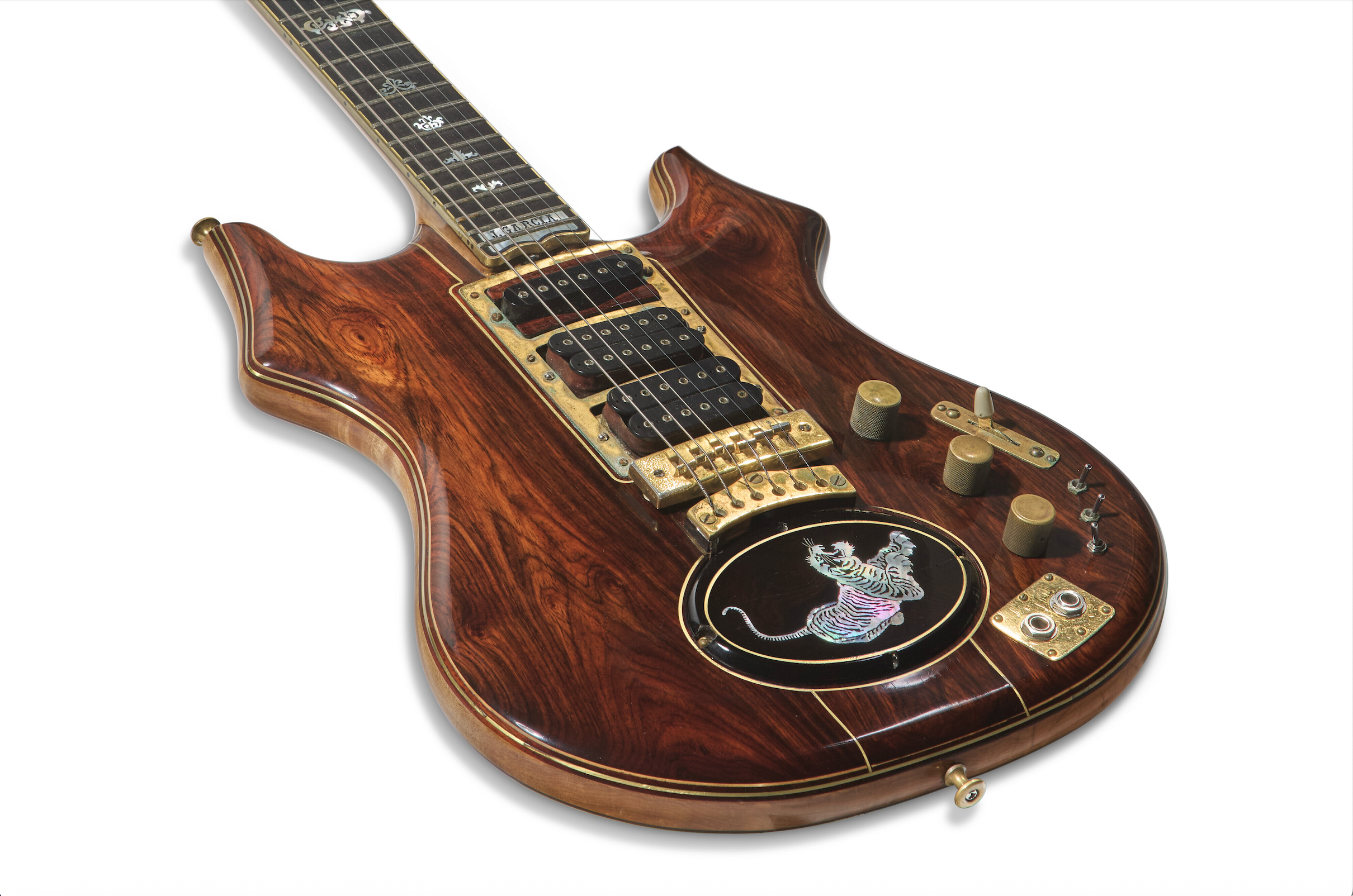 Custom electric guitar featuring a beautifully crafted wooden body, intricate inlays, and unique hardware, ideal for musicians and collectors.