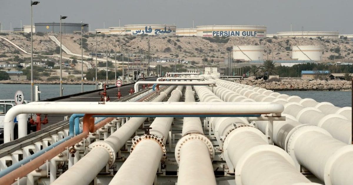 Pipelines leading to oil storage facilities near the Persian Gulf, showcasing industrial infrastructure and maritime operations in the region.