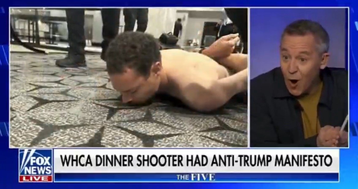 Man restrained on the floor during a news segment discussing an incident involving a shooting at the WHCA dinner and an anti-Trump manifesto.