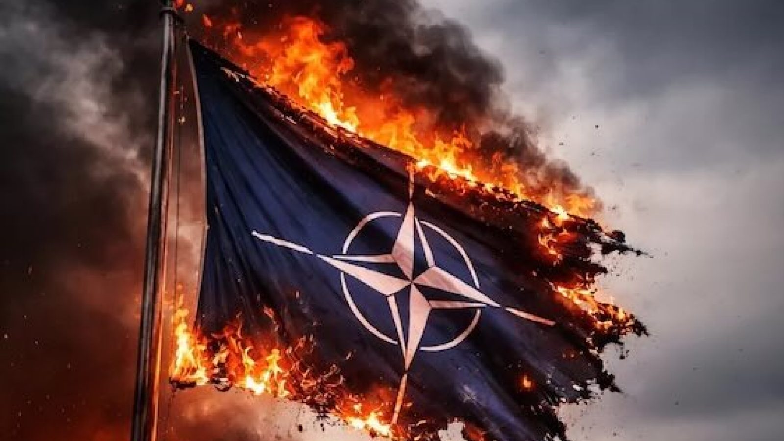 NATO flag engulfed in flames against a dramatic sky