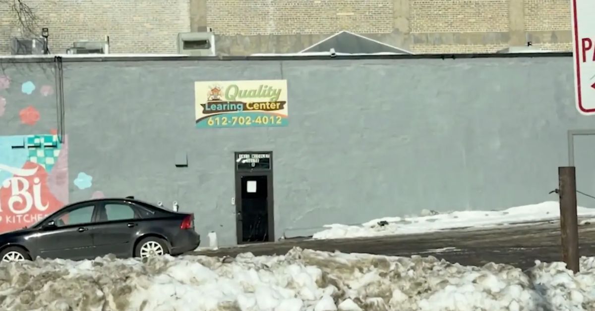 Exterior view of Quality Learning Center building with contact number 612-702-4012, surrounded by snow and a parked car.