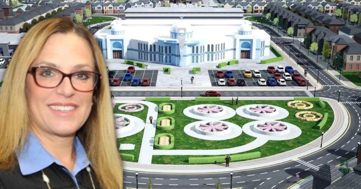 Architectural rendering of a modern building with landscaped gardens and a parking area, featuring a woman smiling in the foreground.