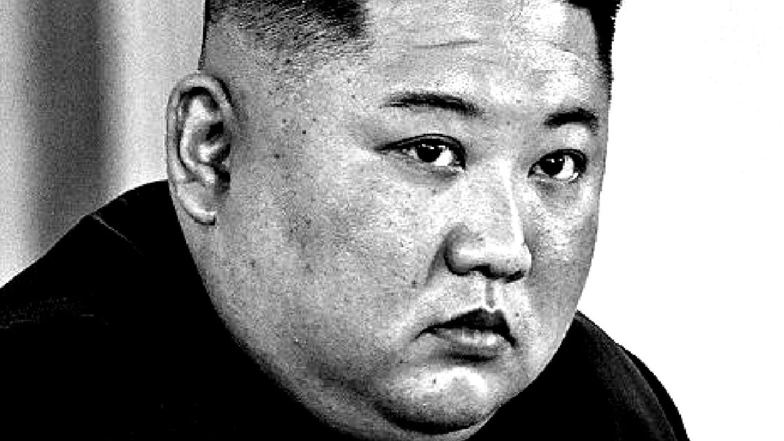 Close-up portrait of a serious man with a shaved hairstyle, conveying a sense of authority and contemplation.