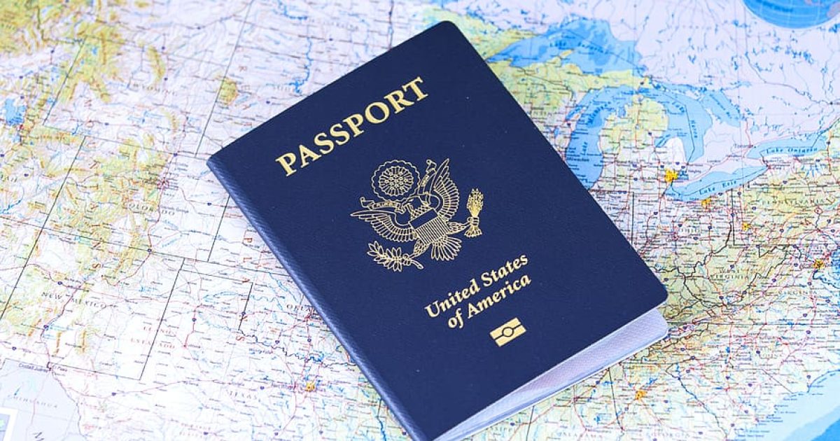 United States passport resting on a detailed map, symbolizing travel and exploration.