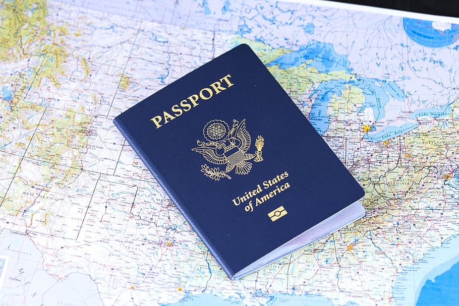 United States passport resting on a detailed map, symbolizing travel and exploration.