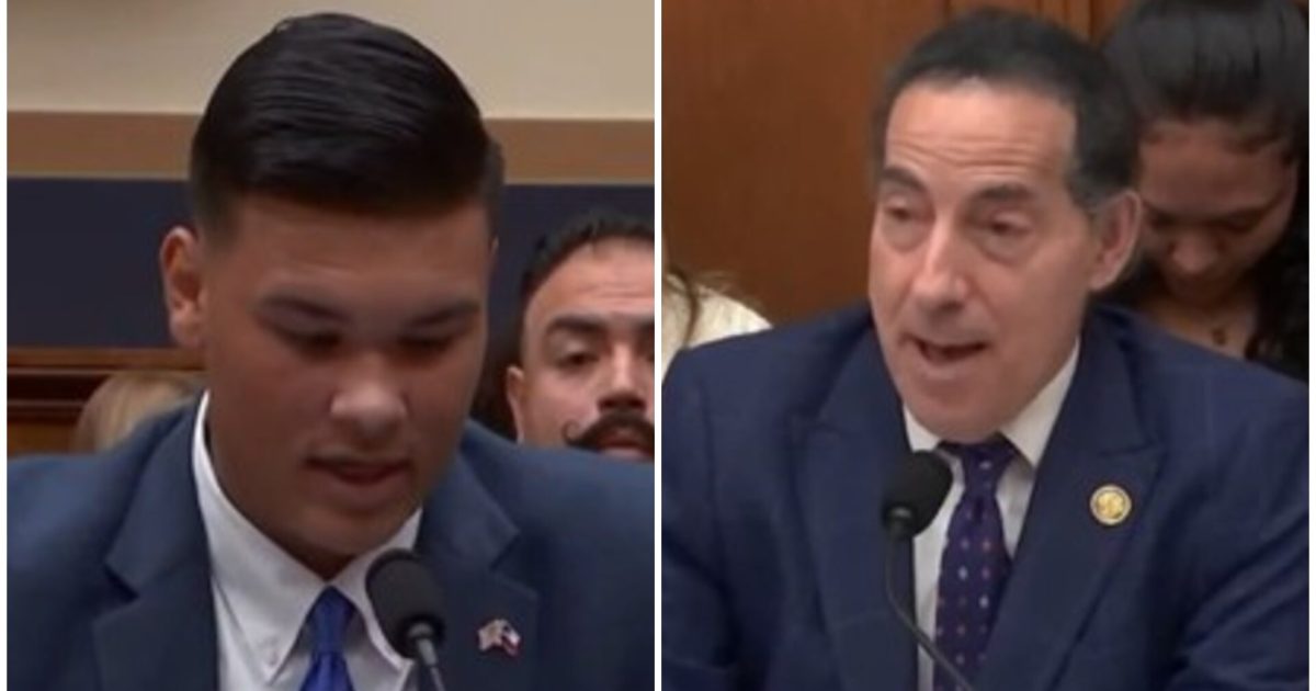 Two men speaking at a congressional hearing, one delivering testimony and the other responding, with an audience visible in the background.