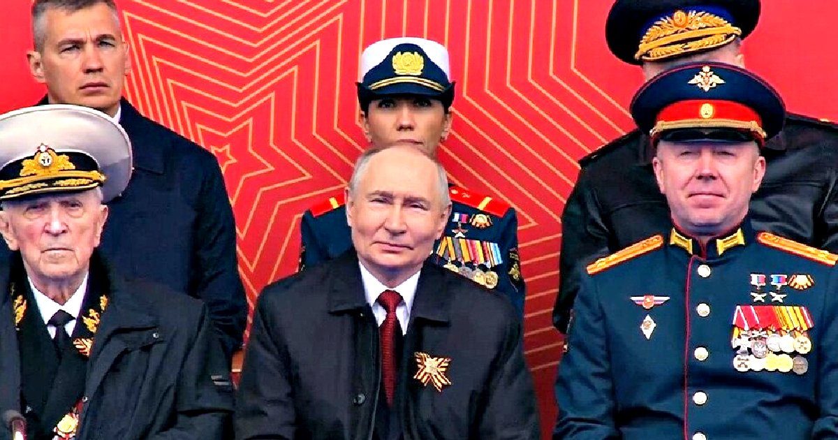 Russian leaders, including Vladimir Putin, attend a military event, showcasing military attire and decorations against a vibrant red background.