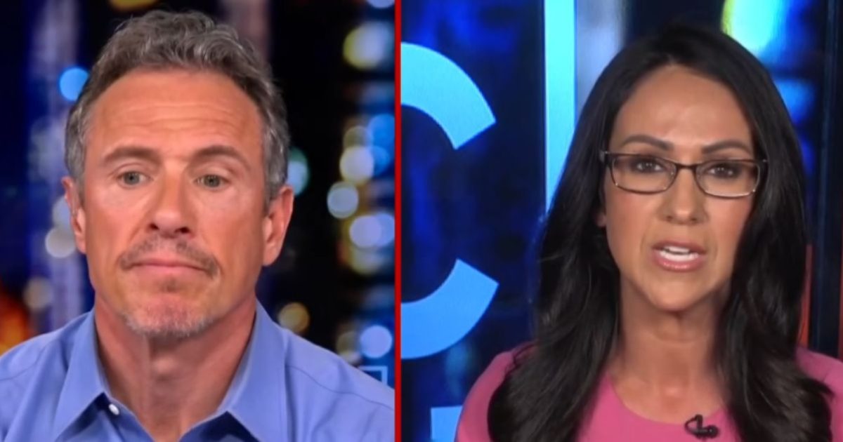 Two news anchors engage in a serious discussion on a televised program, with a colorful backdrop highlighting their expressions and the topic at hand.