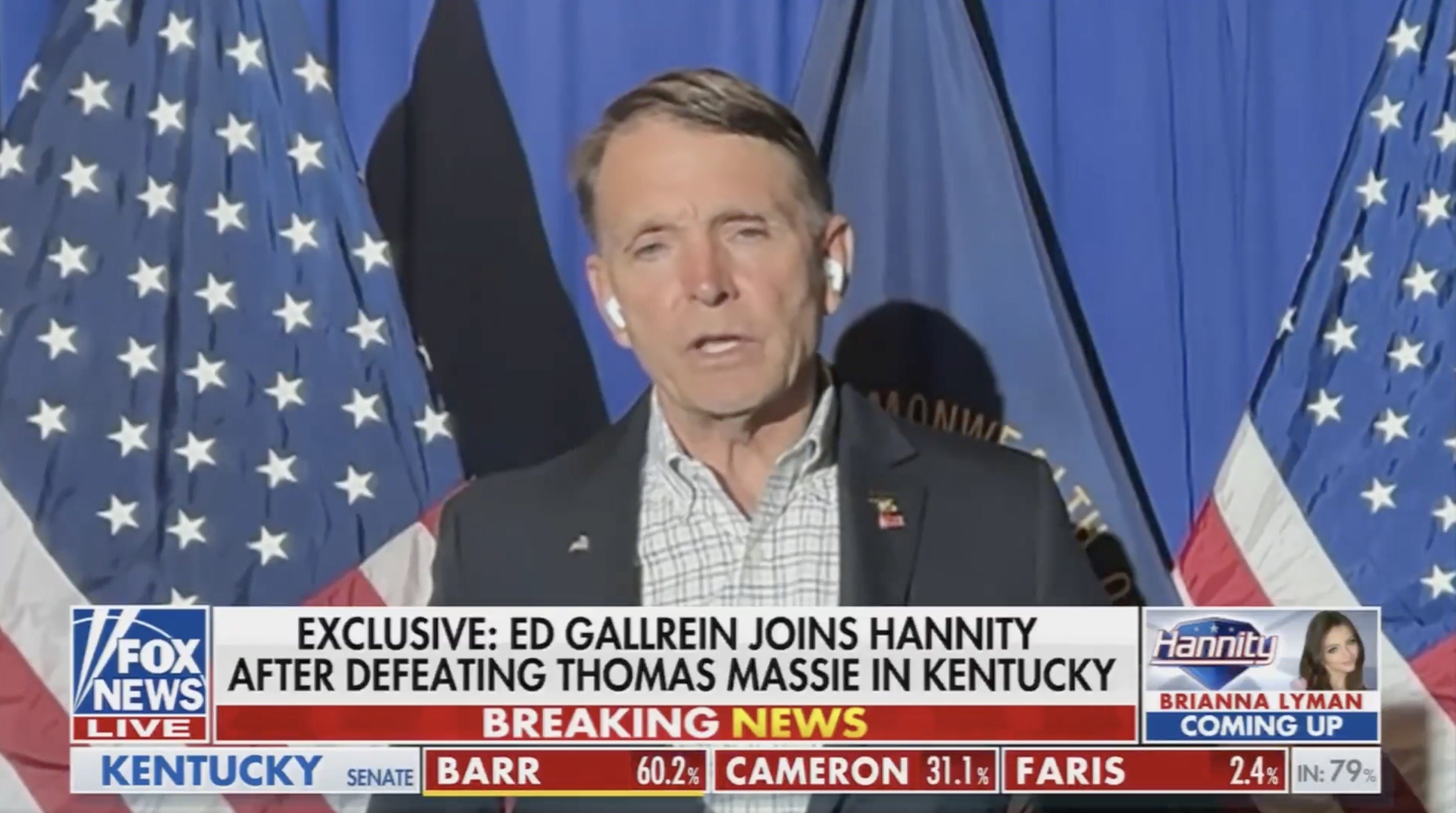 Ed Gallrein speaks on Fox News after winning against Thomas Massie in Kentucky, with American flags in the background.