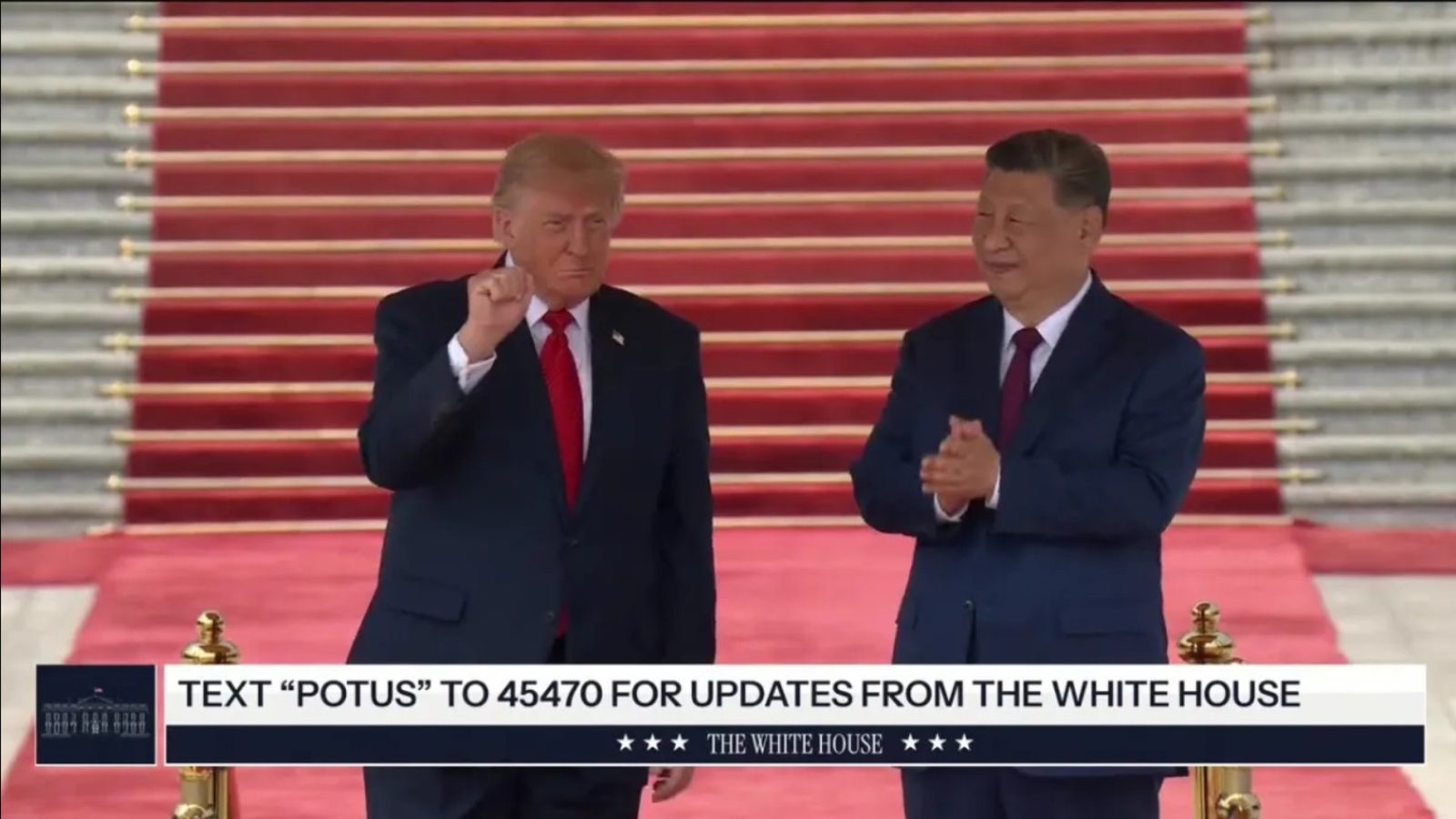 Former US President Donald Trump and Chinese President Xi Jinping stand together on a red carpet during a formal event, showcasing international diplomatic relations.