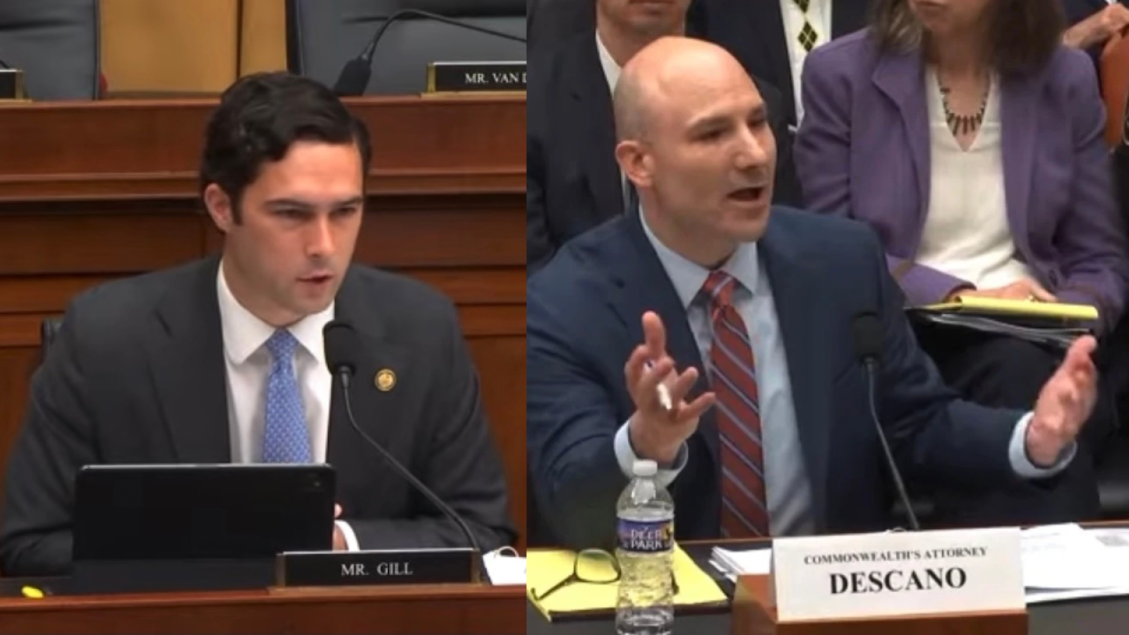 Two men engaged in a heated discussion during a congressional hearing, with one speaking passionately while the other listens intently.