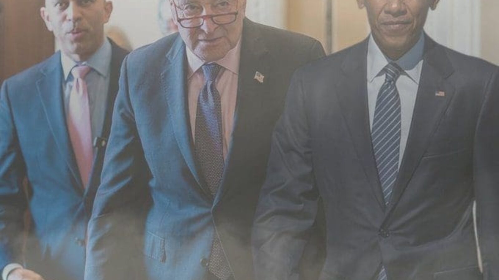 Prominent political figures walking together in a hallway, highlighting collaboration and leadership in government.
