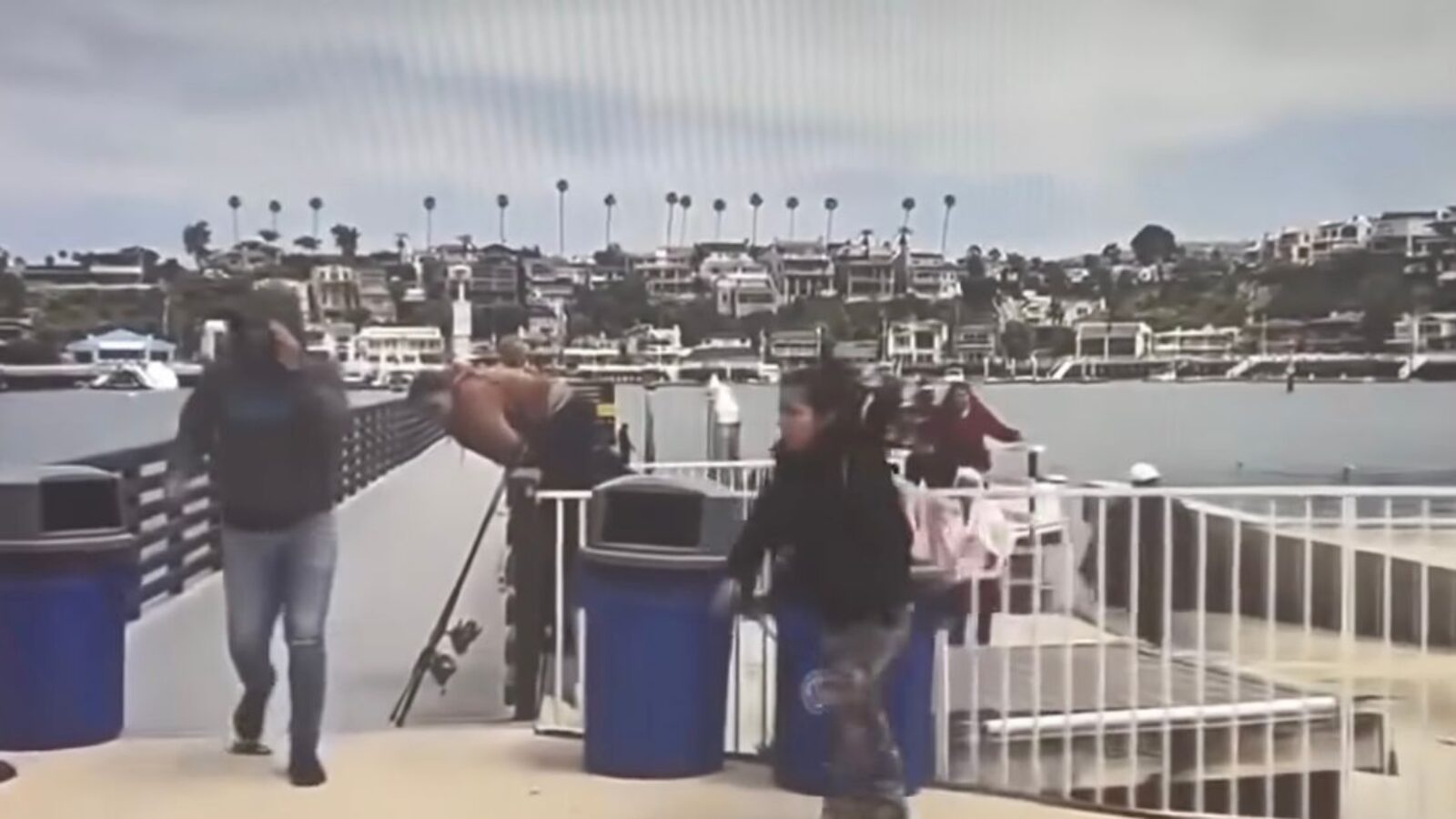 Unidentified individuals climb off of a panga that landed in Newport Beach, California.