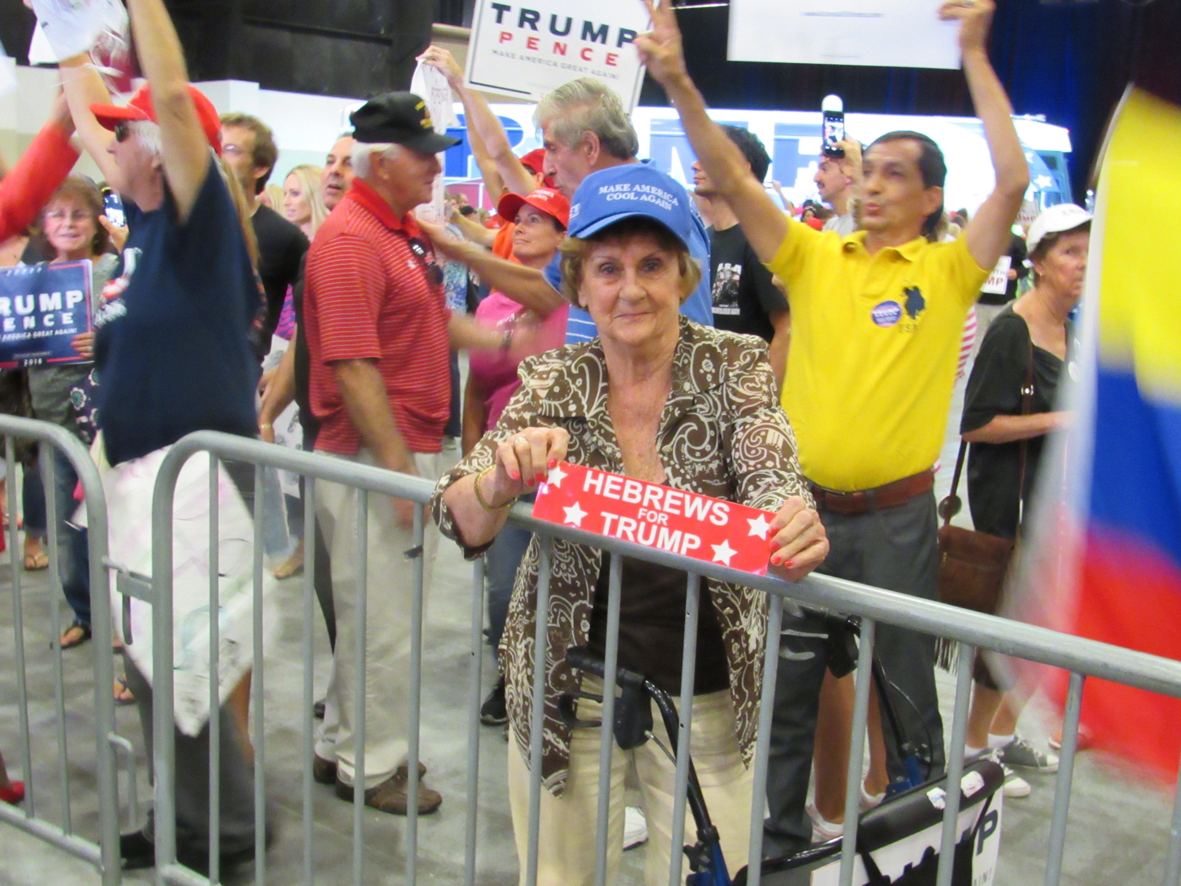Woman holds 'Hebrews for Trump' sticker at media pen after Trump West Palm Beach rally