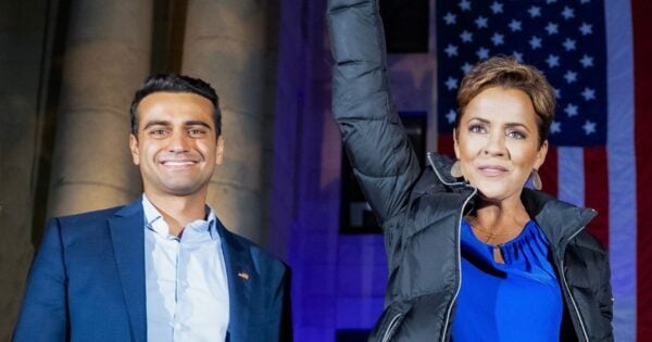 Arizona Republican candidates Abe Hamadeh and Kari Lake stand together.