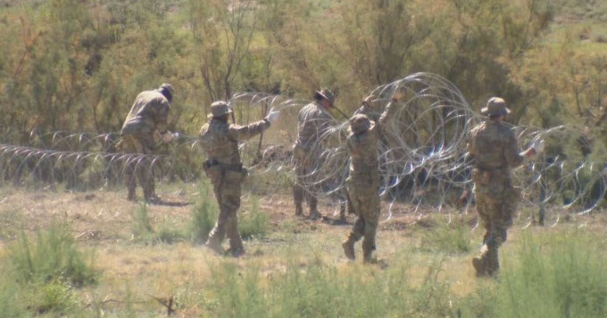 Texas National Guard troops erect razor-wire barriers near the state border with New Mexico.