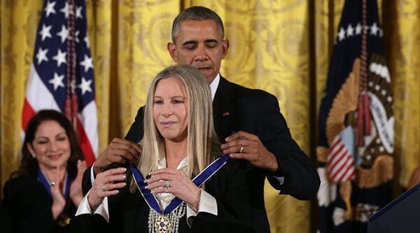 WASHINGTON, DC - NOVEMBER 24: U.S. President Barack Obama (R) presents the Presidential Medal of Freedom to singer Barbra Streisand (L) during an East Room ceremony November 24, 2015 at the White House in Washington, DC. Seventeen recipients were awarded with the nationÕs highest civilian honor. (Photo