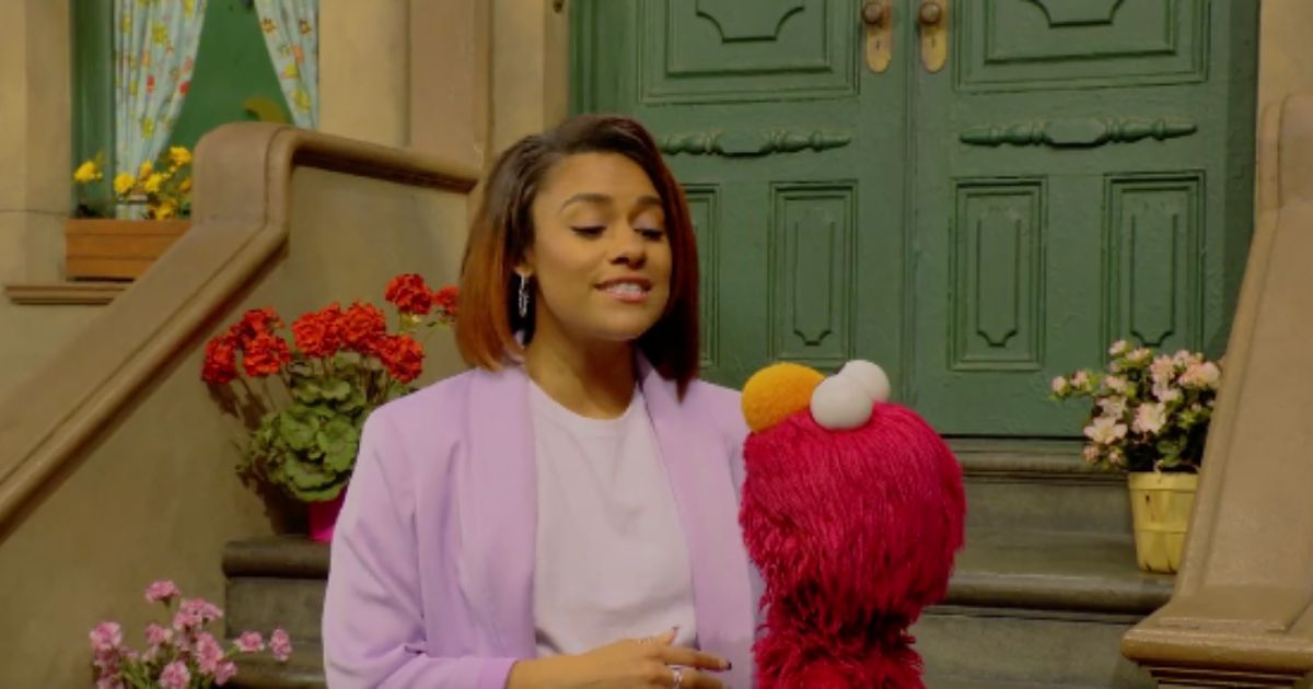 Acress Ariana DeBose is seen on "Sesame Street" with Elmo.