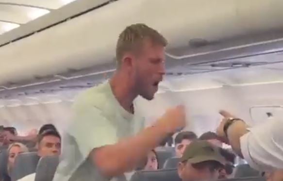 ANOTHER FLIGHT FREAKOUT! British Passenger Screams at Passengers Then Goes for the Door When Two Men Take Him Down (VIDEO)