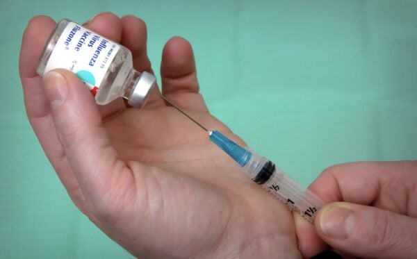 Hospital Pays Job Applicant Who Refused Mandated Flu Shot