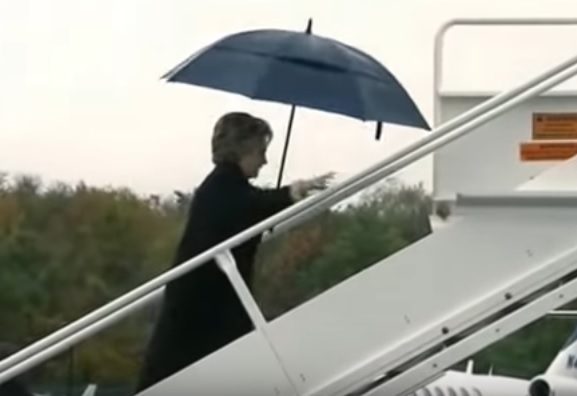 hillary-stumbles-mumbling-plane