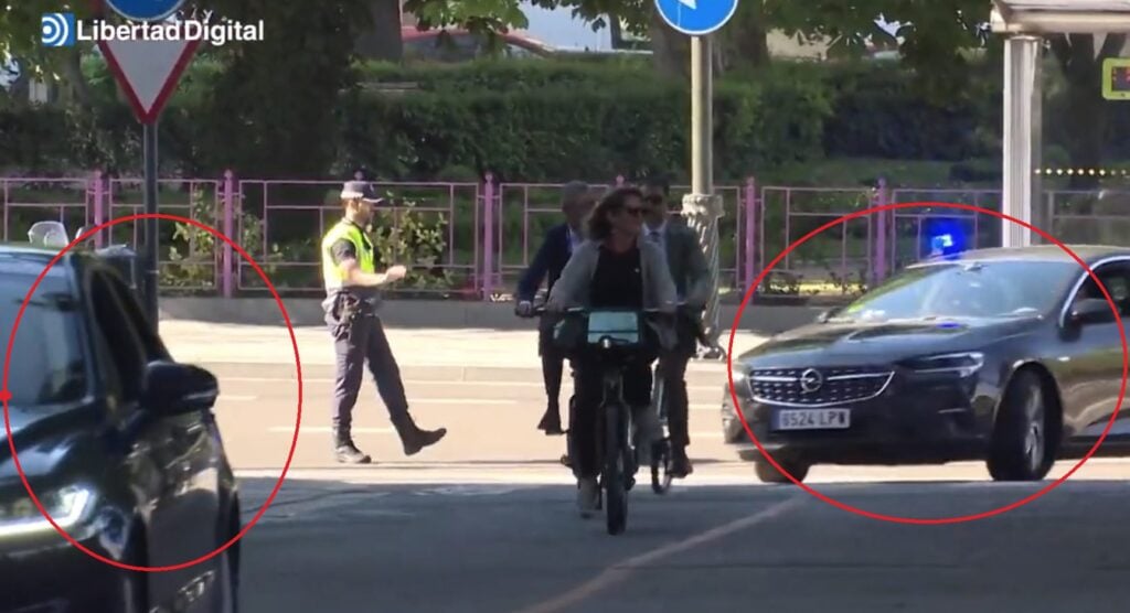 Spanish Environmenal Minister Rides a Bike to Meeting with EU Colleagues Flanked by Gas Guzzling Armored Cars