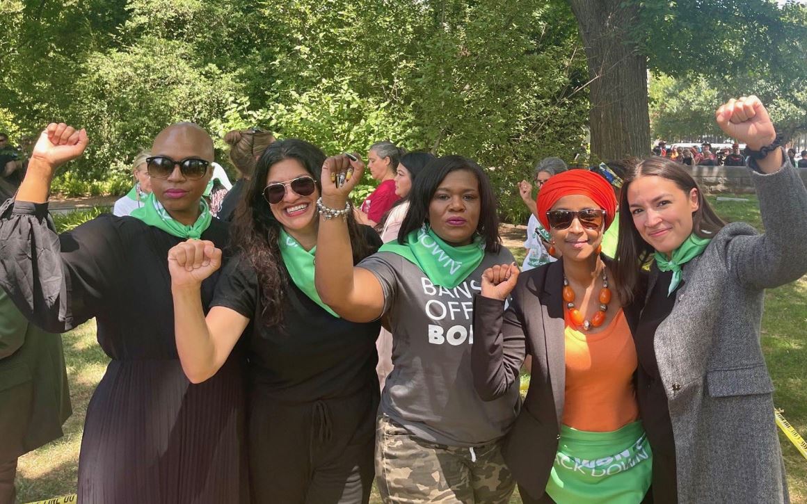 Democrat Thought Leader and Twit AOC Demanded Josh Hawley Resign for Raising a Fist at Protest -- Then She Raises a Fist at Protest During Fake Handcuff Stunt | The Gateway Pundit | by Jim Hoft